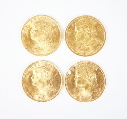 Ensemble de quatre pièces de 20 francs suisses...