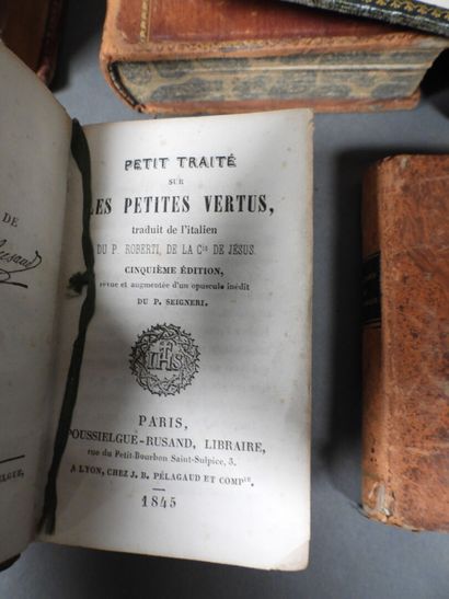 Approximately 7 religious volumes in various...