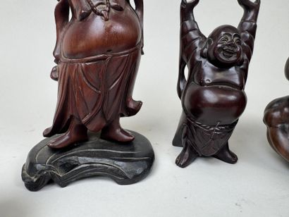 ASIE, XXe.
Quatre bouddhas en résine et bois...