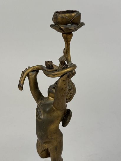 Petit angelot en bronze doré formant bougeoir,...