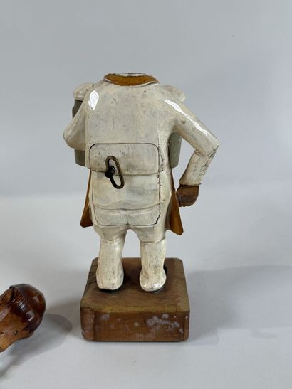 ANRI.
Personnage en bois sculpté et peint,...