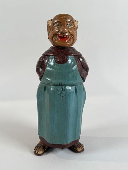 Personnage en bois sculpté et peint. Équipé...