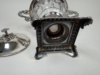 A jam jar or candy dish made of faceted glass...