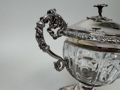 A jam jar or candy dish made of faceted glass...