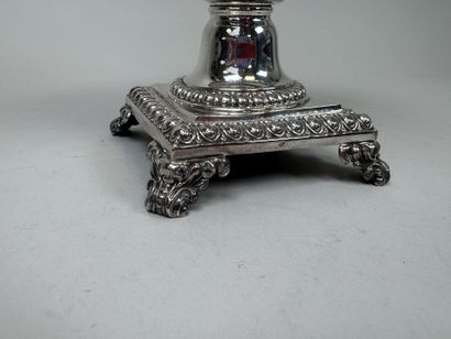 A jam jar or candy dish made of faceted glass...