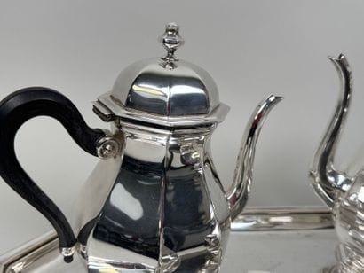 A silver plated coffee and tea set with beveled...