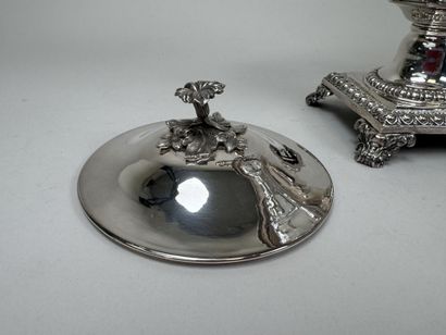A jam jar or candy dish made of faceted glass...