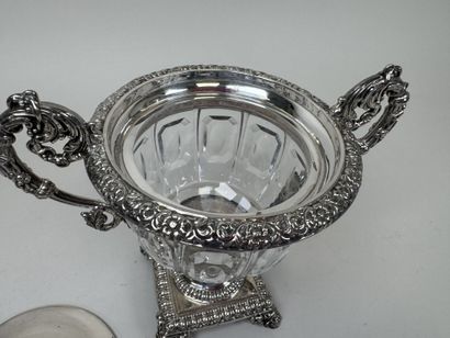 A jam jar or candy dish made of faceted glass...