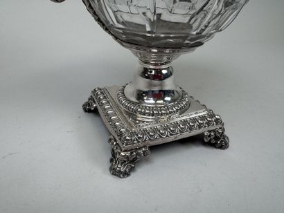 A jam jar or candy dish made of faceted glass...
