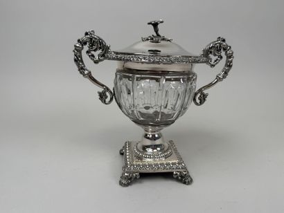 A jam jar or candy dish made of faceted glass...