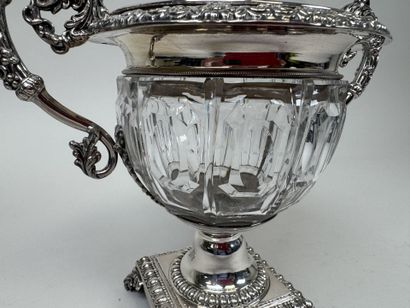 A jam jar or candy dish made of faceted glass...