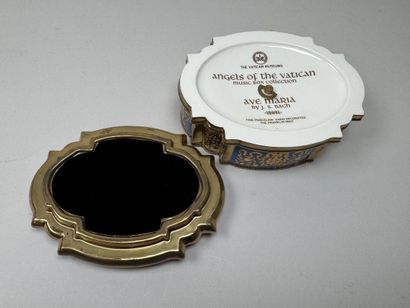 A music box that doubles as a jewelry box,...