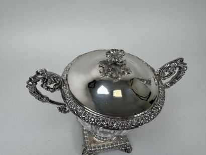 A jam jar or candy dish made of faceted glass...