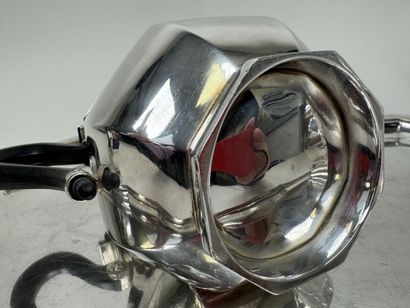 A silver plated coffee and tea set with beveled...