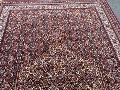Large machine-woven rug made of multicolored...