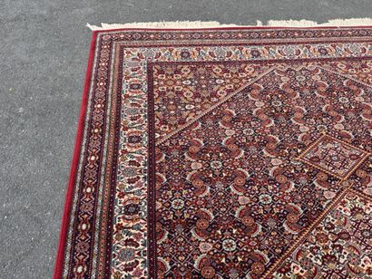 Large machine-woven rug made of multicolored...