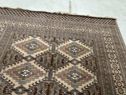Large machine-woven wool rug featuring geometric...
