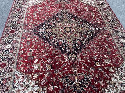 Machine-woven wool rug with a knotted design...