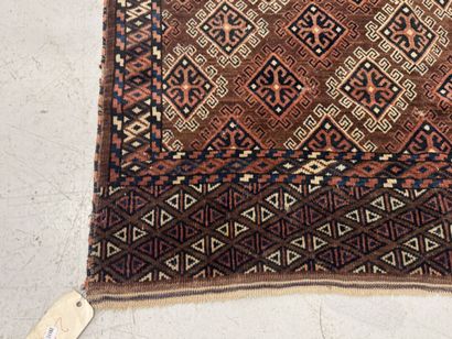 Hand-knotted wool rug featuring stylized...