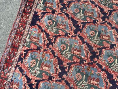 Hand-knotted wool rug with a landscape design.
158...