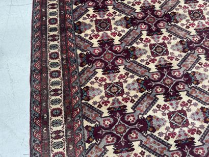 IRAN.
Hand-knotted wool rug with stylized...