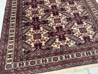 IRAN.
Hand-knotted wool rug with stylized...