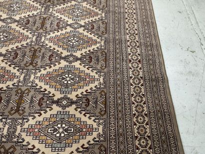 Large machine-woven wool rug featuring geometric...