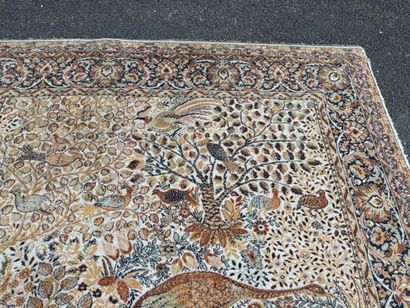 A significant hand-knotted wool rug featuring...