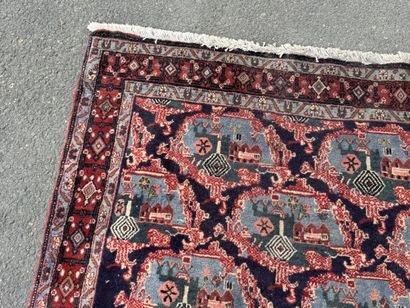 Hand-knotted wool rug with a landscape design.
158...