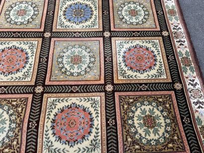 Large, multicolored machine-woven rug featuring...