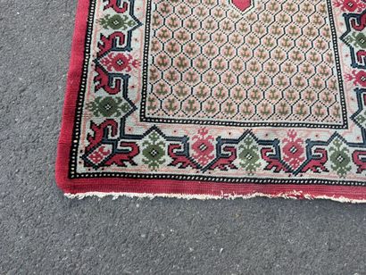 Hand-knotted wool gallery rug with a decorative...