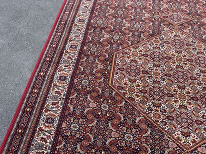 Large machine-woven rug made of multicolored...
