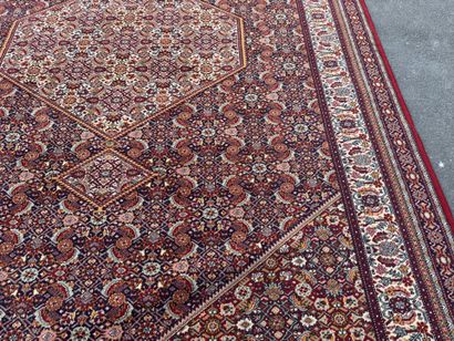 Large machine-woven rug made of multicolored...