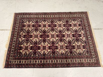 IRAN.
Hand-knotted wool rug with stylized...