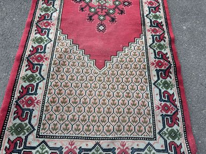 Hand-knotted wool gallery rug with a decorative...