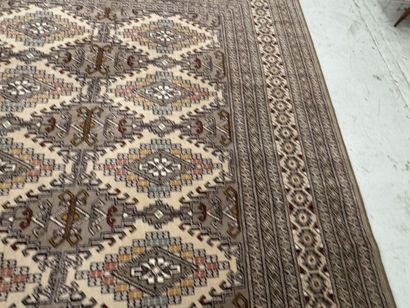 Large machine-woven wool rug featuring geometric...