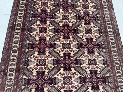 IRAN.
Hand-knotted wool rug with stylized...