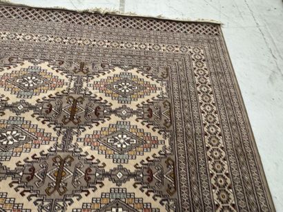Large machine-woven wool rug featuring geometric...