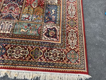Large, multicolored machine-woven rug featuring...