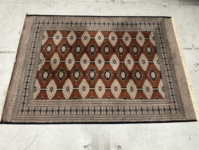 Large machine-woven wool rug featuring geometric...