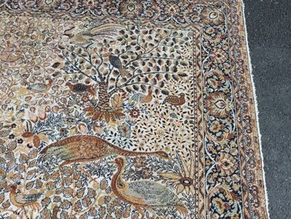 A significant hand-knotted wool rug featuring...