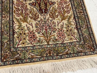 Small wool and silk rug with a leaf-and-vine...