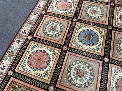 Large, multicolored machine-woven rug featuring...