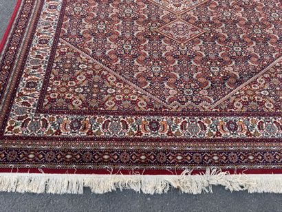 Large machine-woven rug made of multicolored...