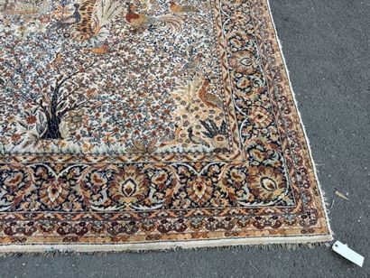A significant hand-knotted wool rug featuring...