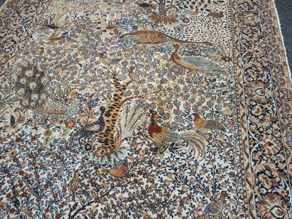 A significant hand-knotted wool rug featuring...