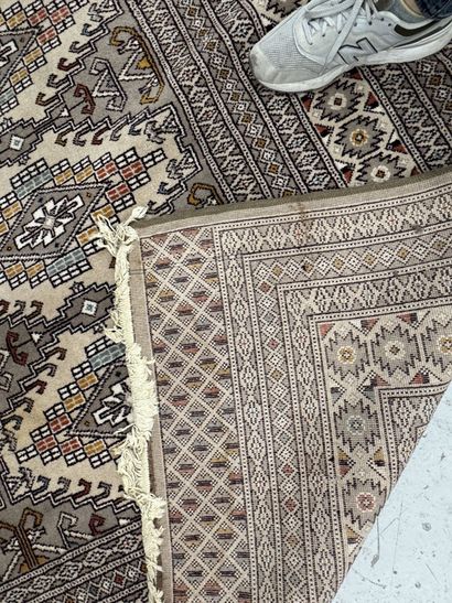 Large machine-woven wool rug featuring geometric...