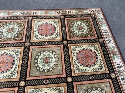 Large, multicolored machine-woven rug featuring...