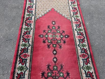 Hand-knotted wool gallery rug with a decorative...