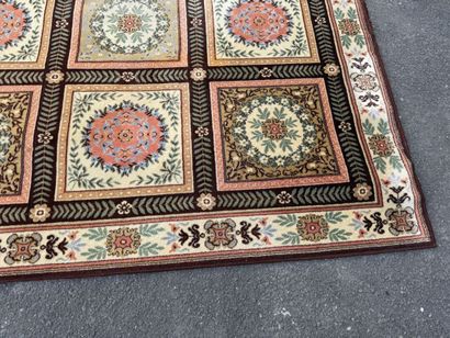 Large, multicolored machine-woven rug featuring...
